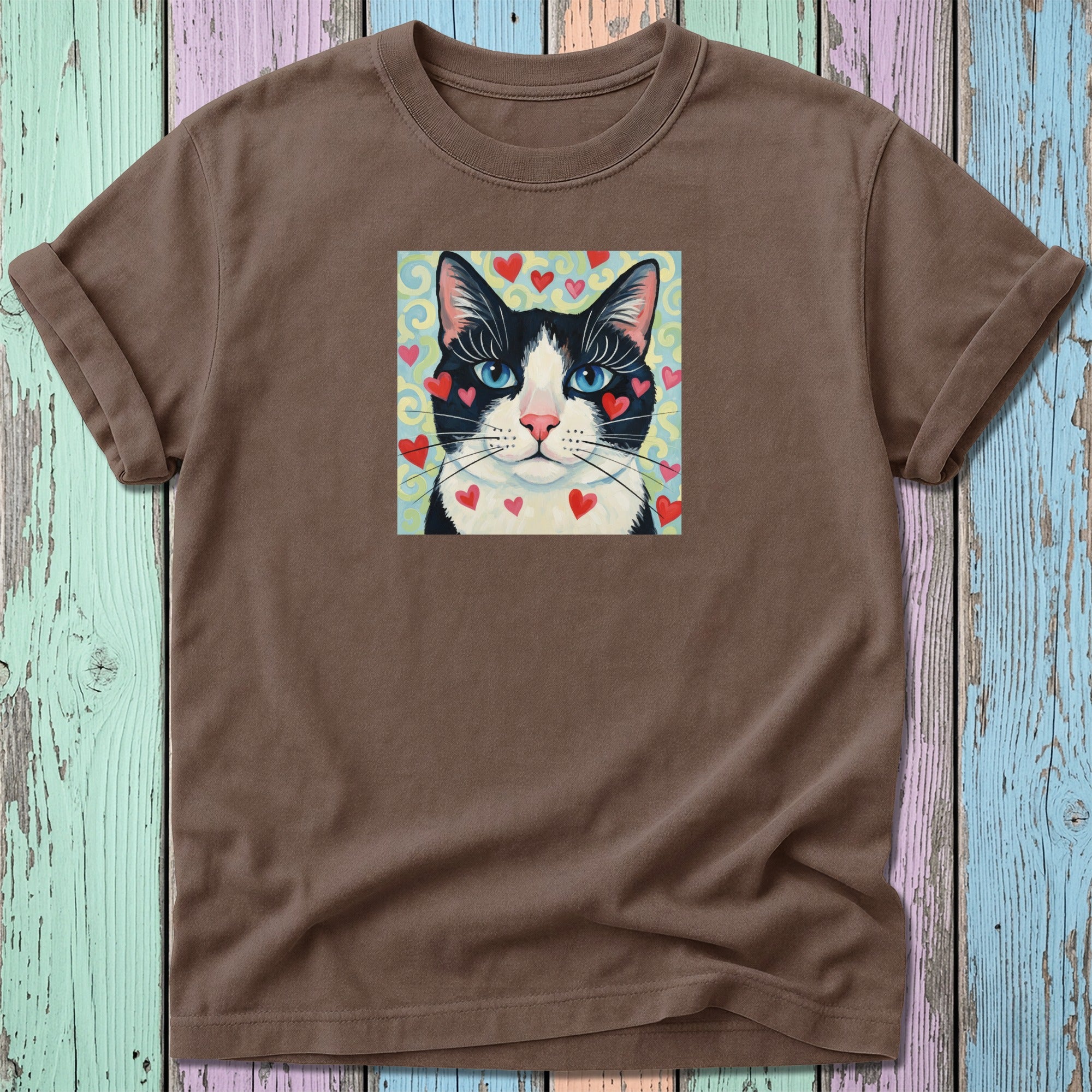 Brown t-shirt with a black and white cat wearing red hearts on its face.