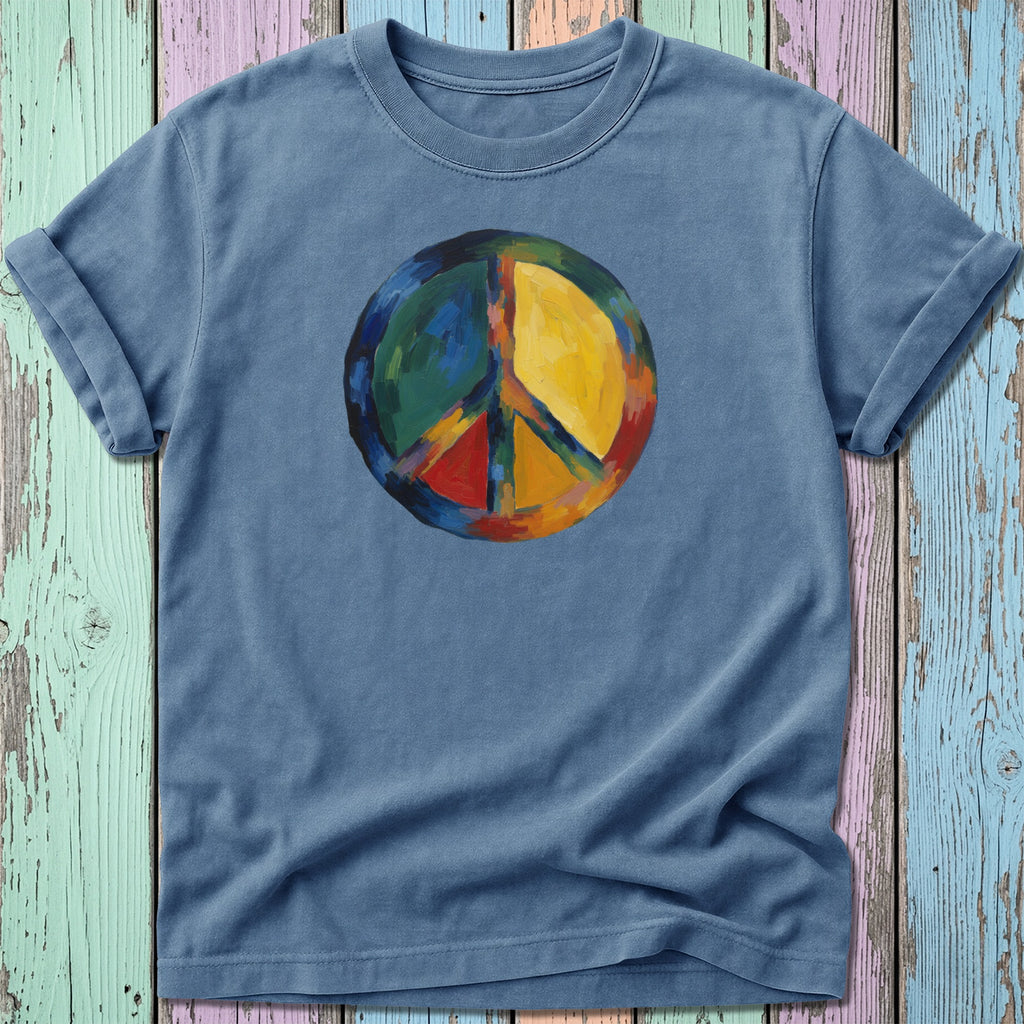 Blue t-shirt featuring a colorful, abstract peace sign design.