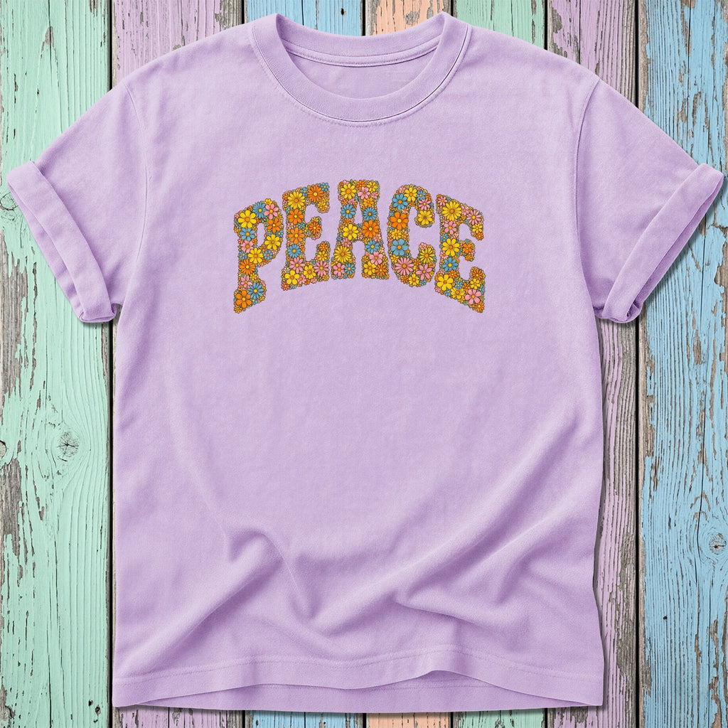 Purple t-shirt with "PEACE" in colorful floral letters.
