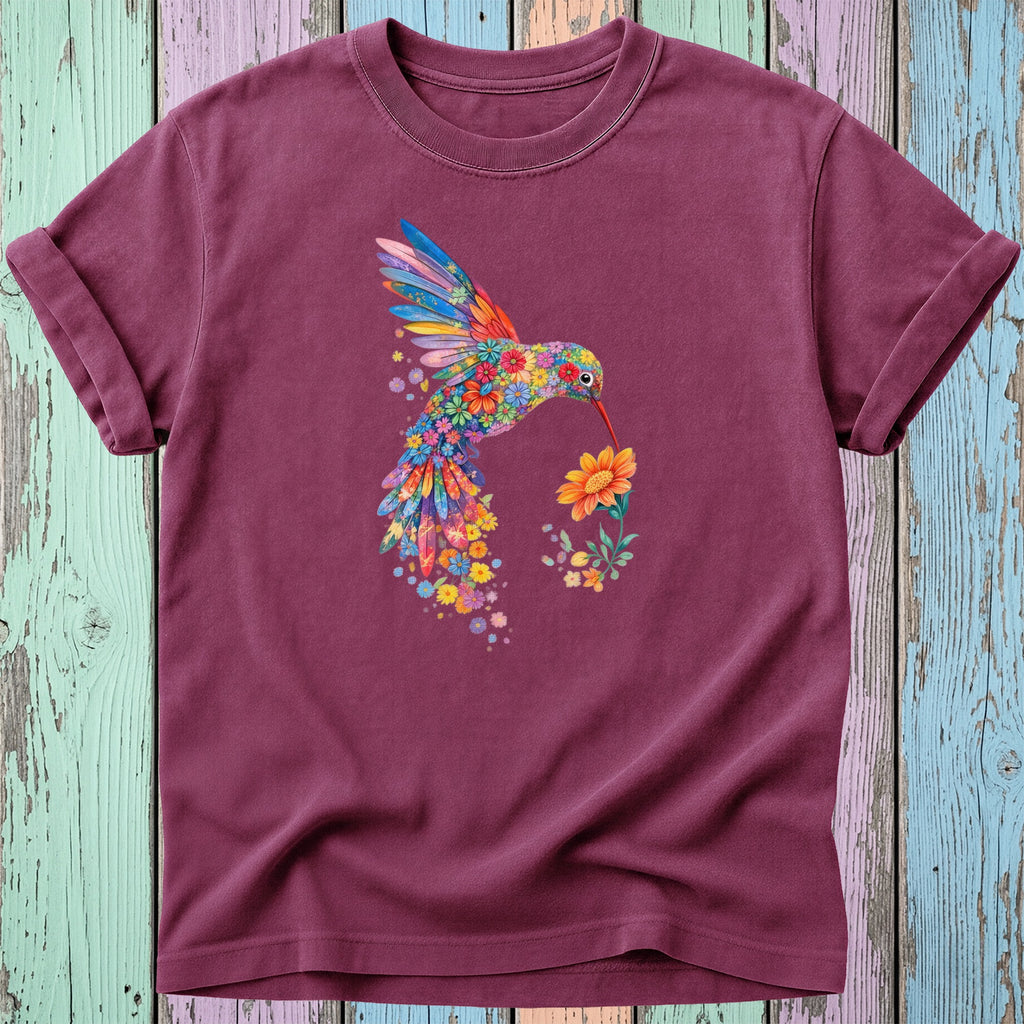 Maroon t-shirt with a colorful floral hummingbird holding a flower.