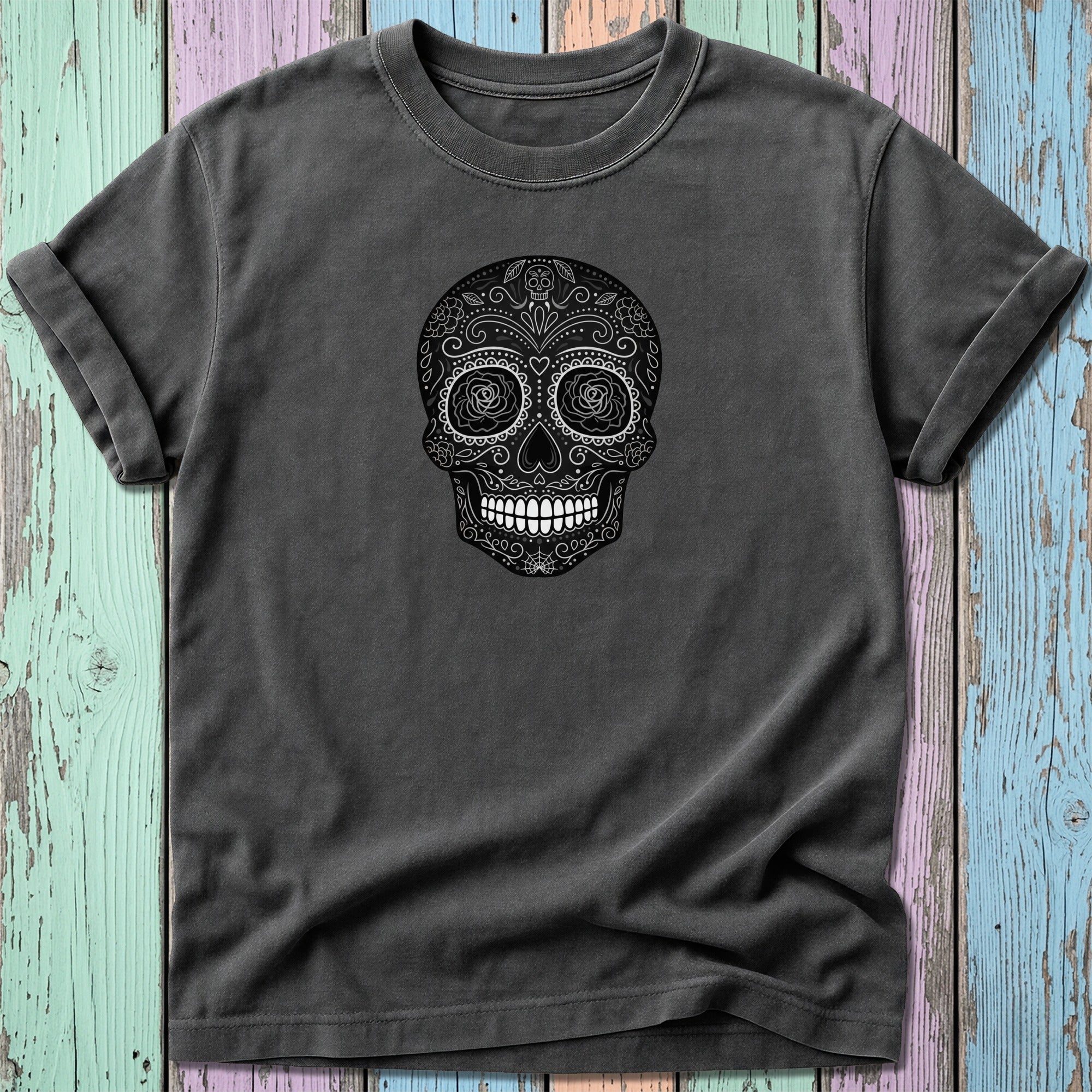 Dark gray t-shirt with a black skull graphic with floral details.