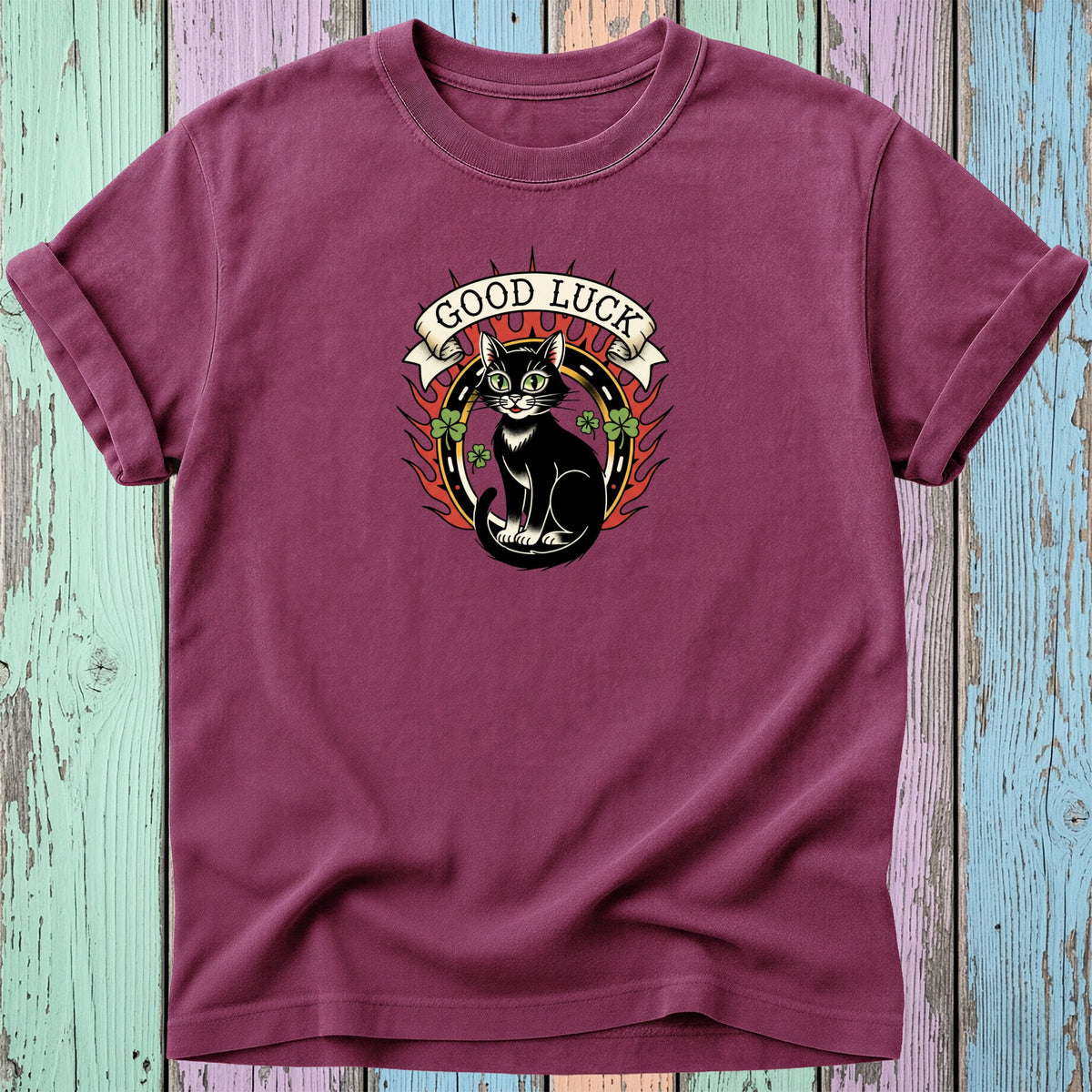 Black cat with "Good Luck" banner on burgundy t-shirt.