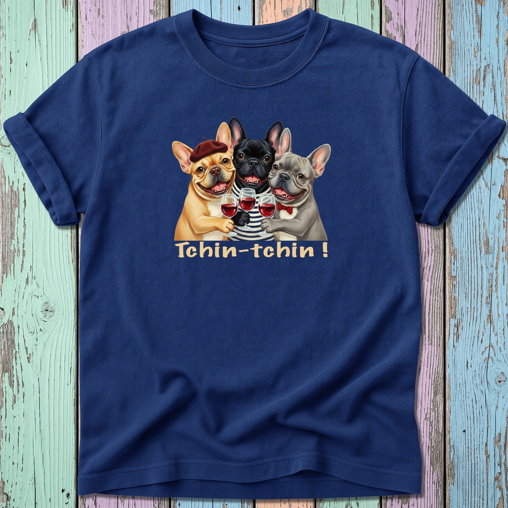 Three French bulldogs in t-shirts toast with glasses of wine.