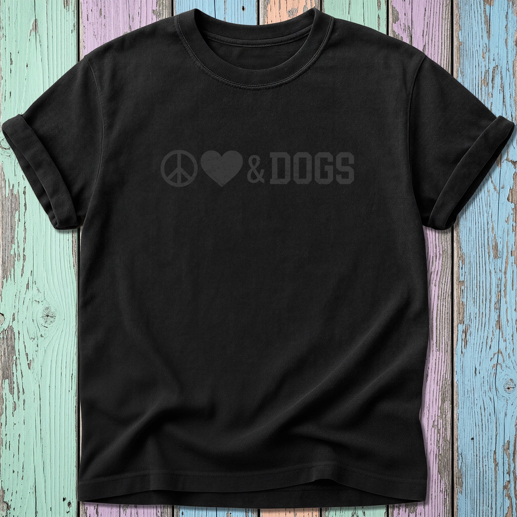 Black t-shirt with peace symbol, heart, and "DOGS" text printed on chest.
