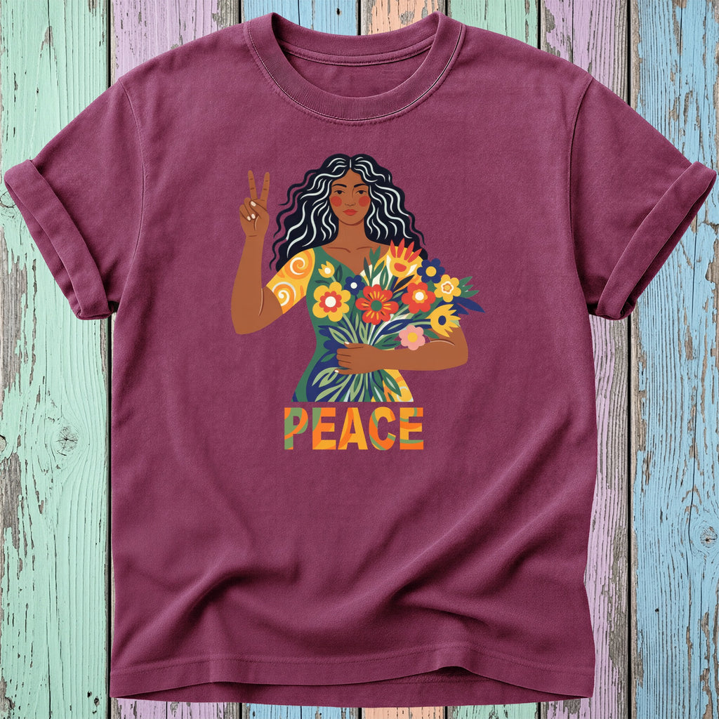 Woman with flowers and peace sign on burgundy t-shirt reading "PEACE".