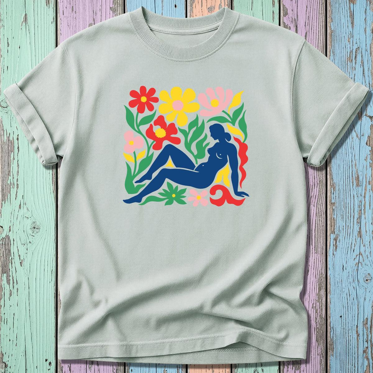 Light gray t-shirt with a colorful floral silhouette design of a reclining nude woman.
