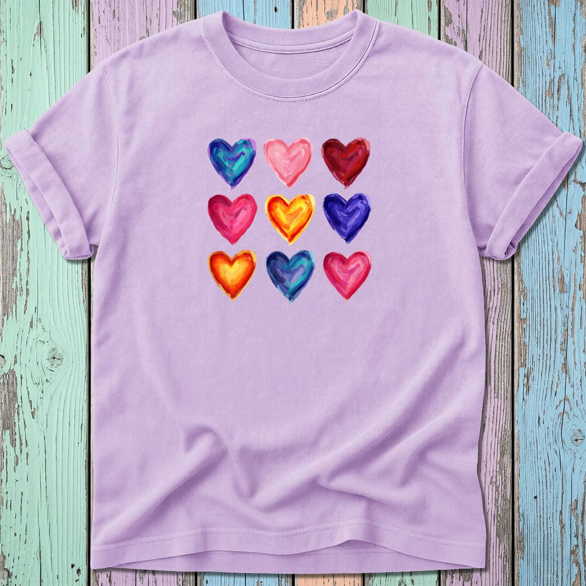 Purple t-shirt with nine colorful watercolor hearts arranged in a grid.