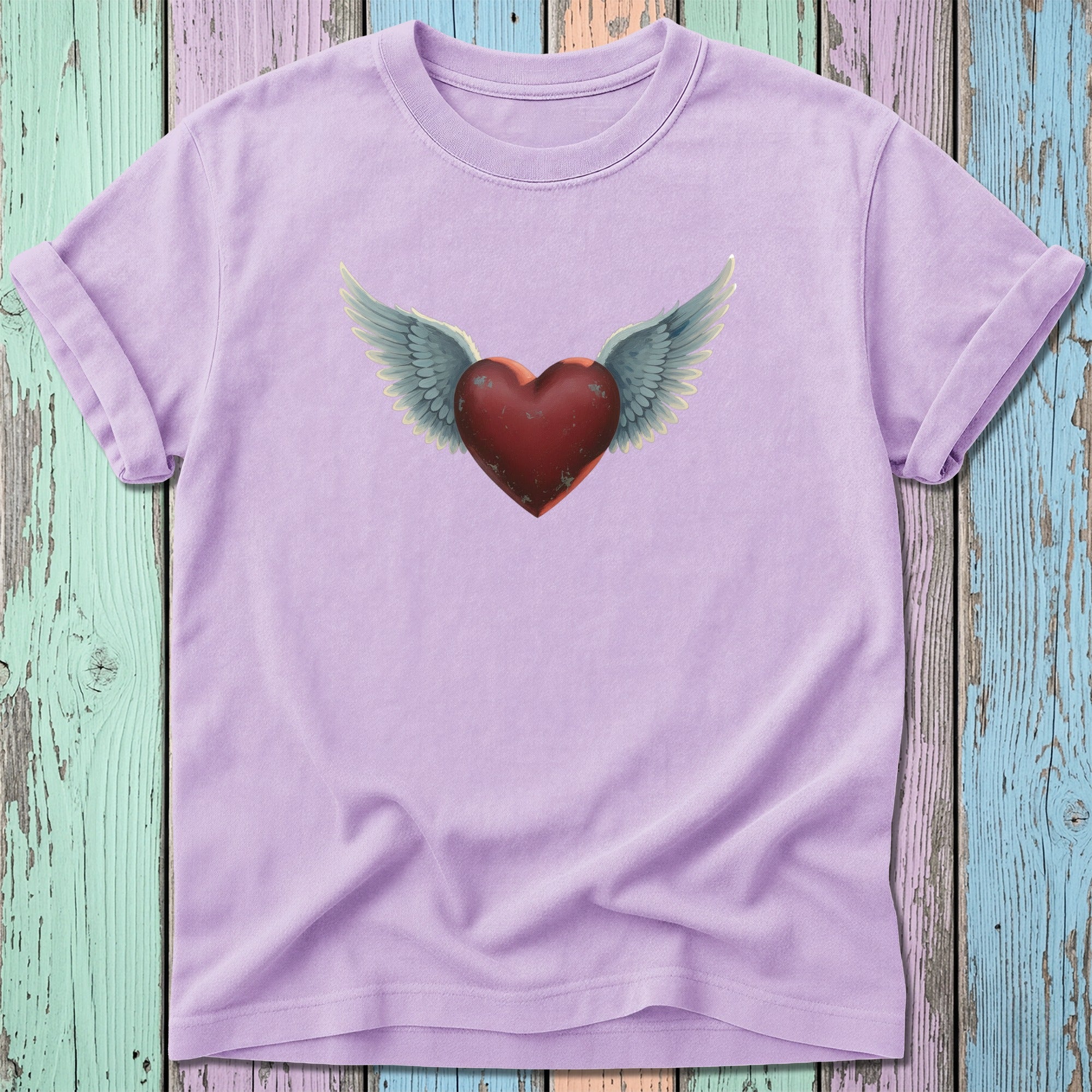 Purple t-shirt with a winged heart graphic.