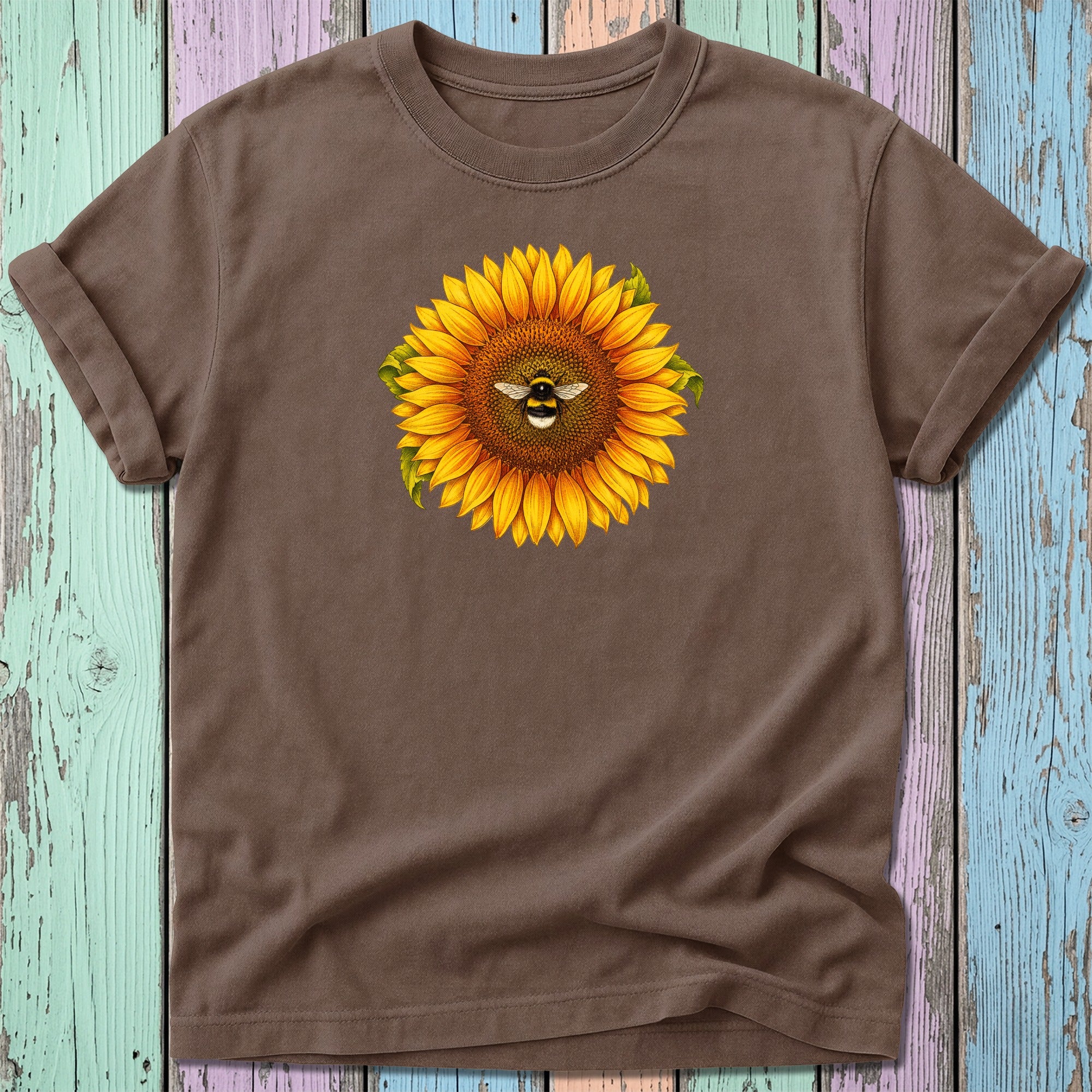 Brown t-shirt with a sunflower and bee graphic centered on the chest.