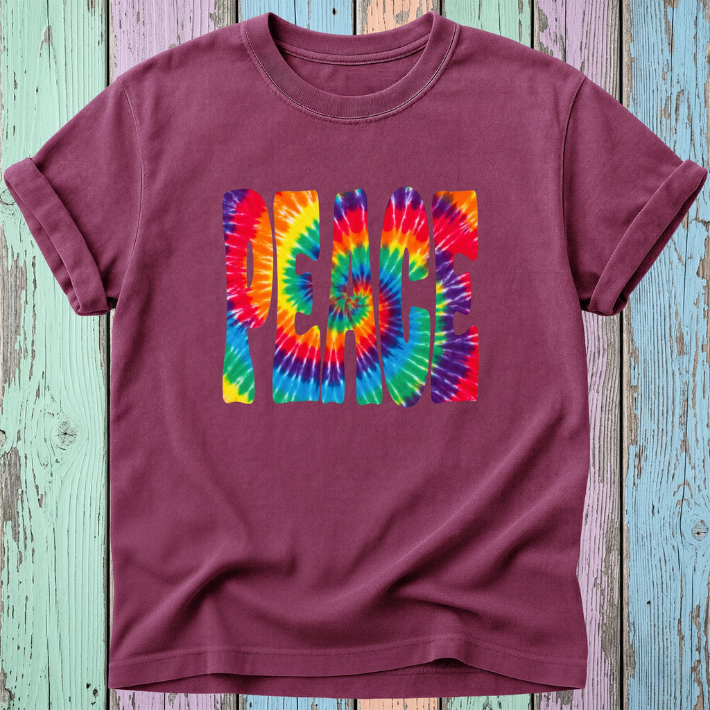 Maroon t-shirt with "PEACE" in a rainbow tie-dye spiral design.