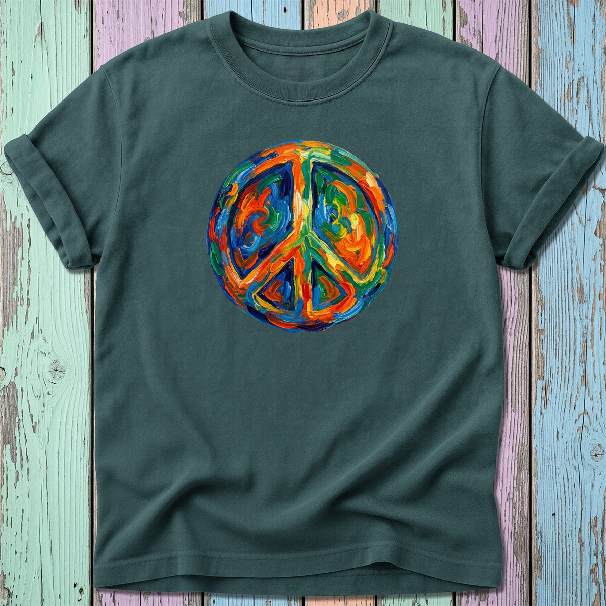 Dark green t-shirt with a circular, painterly peace sign in vibrant colors.