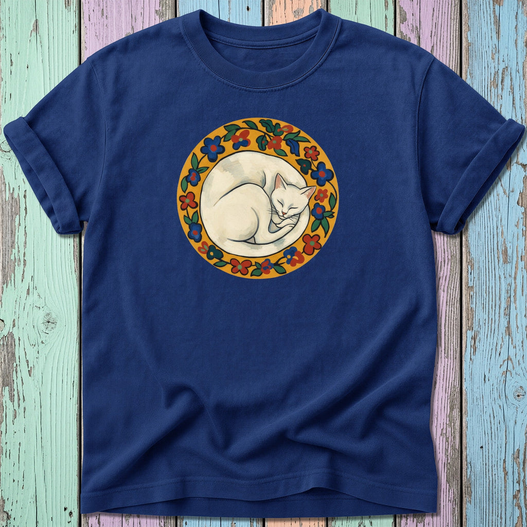 Navy t-shirt with a circular floral design featuring a sleeping white cat.