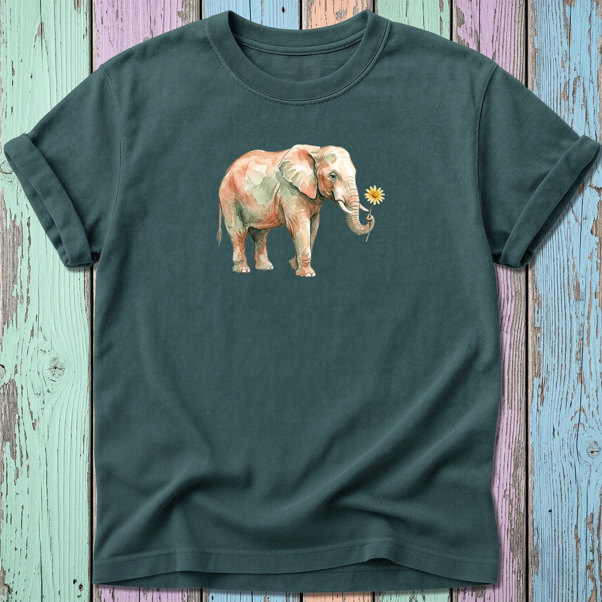 Watercolor elephant with a flower, on a dark green t-shirt.