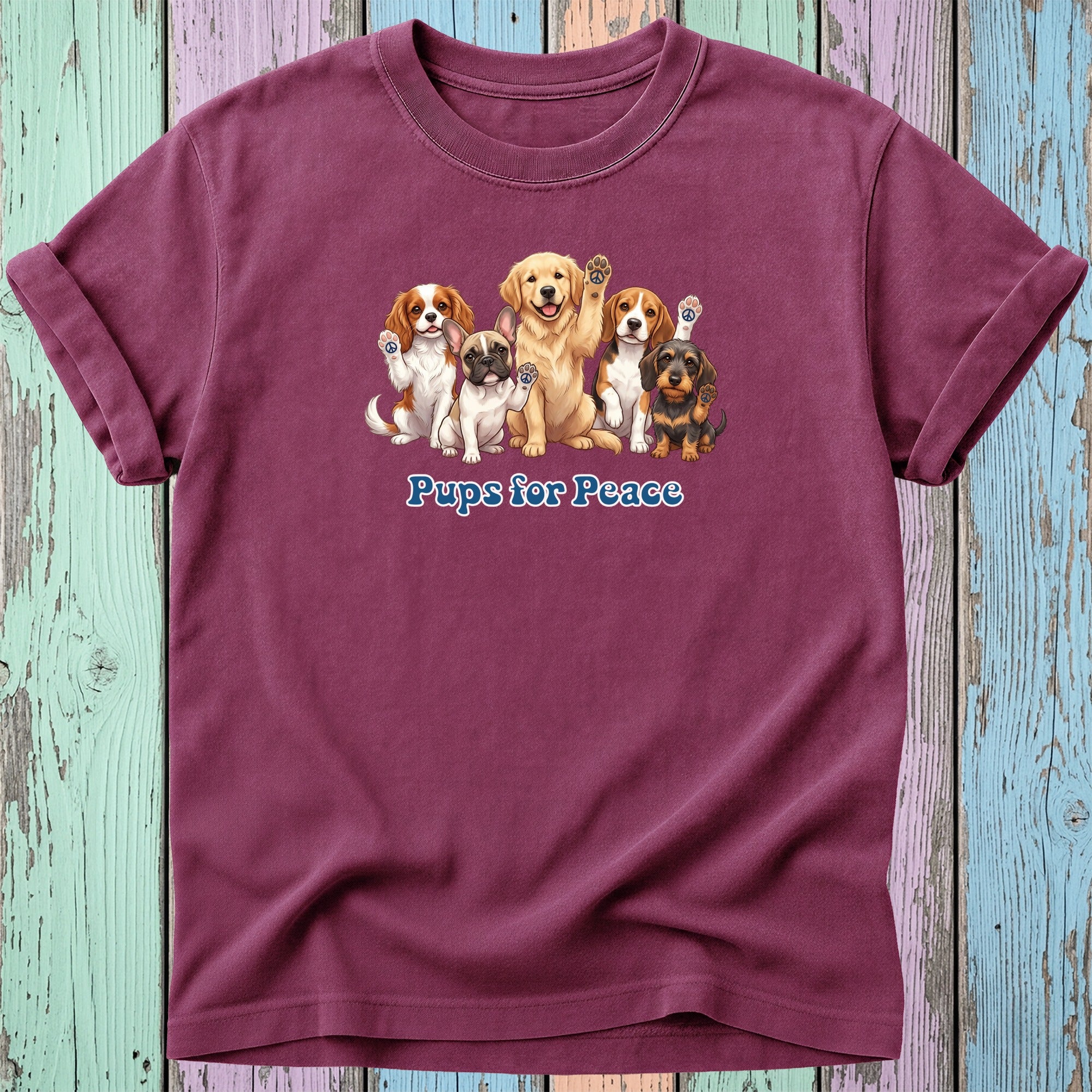 T-shirt with multiple cartoon puppies, paw prints, and "Pups for Peace" text.