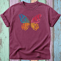 Burgundy t-shirt with a butterfly design of the words Peace, Love, and Happiness.