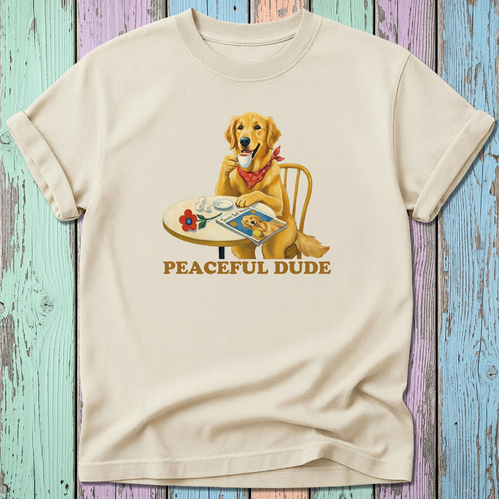 Golden retriever wearing bandana drinks coffee reading magazine.