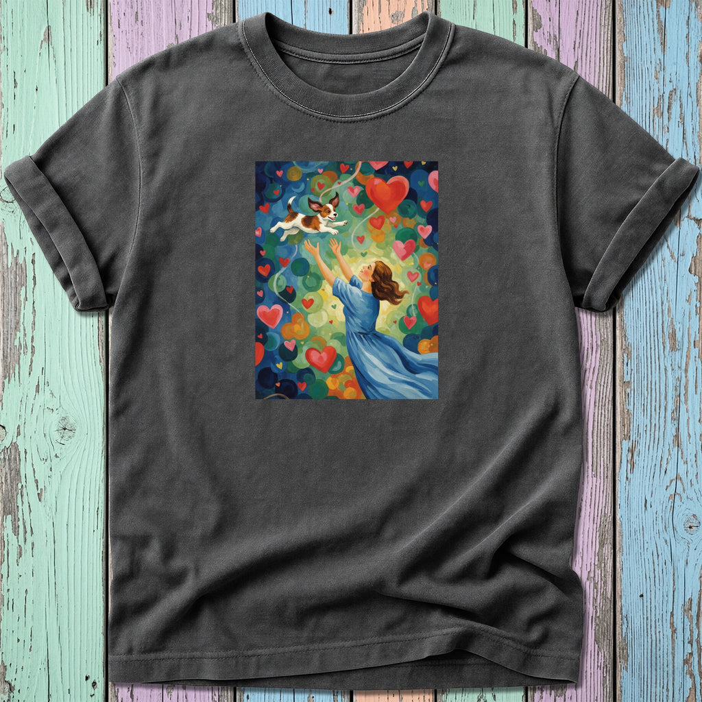 Woman reaching for a flying dog surrounded by colorful hearts.