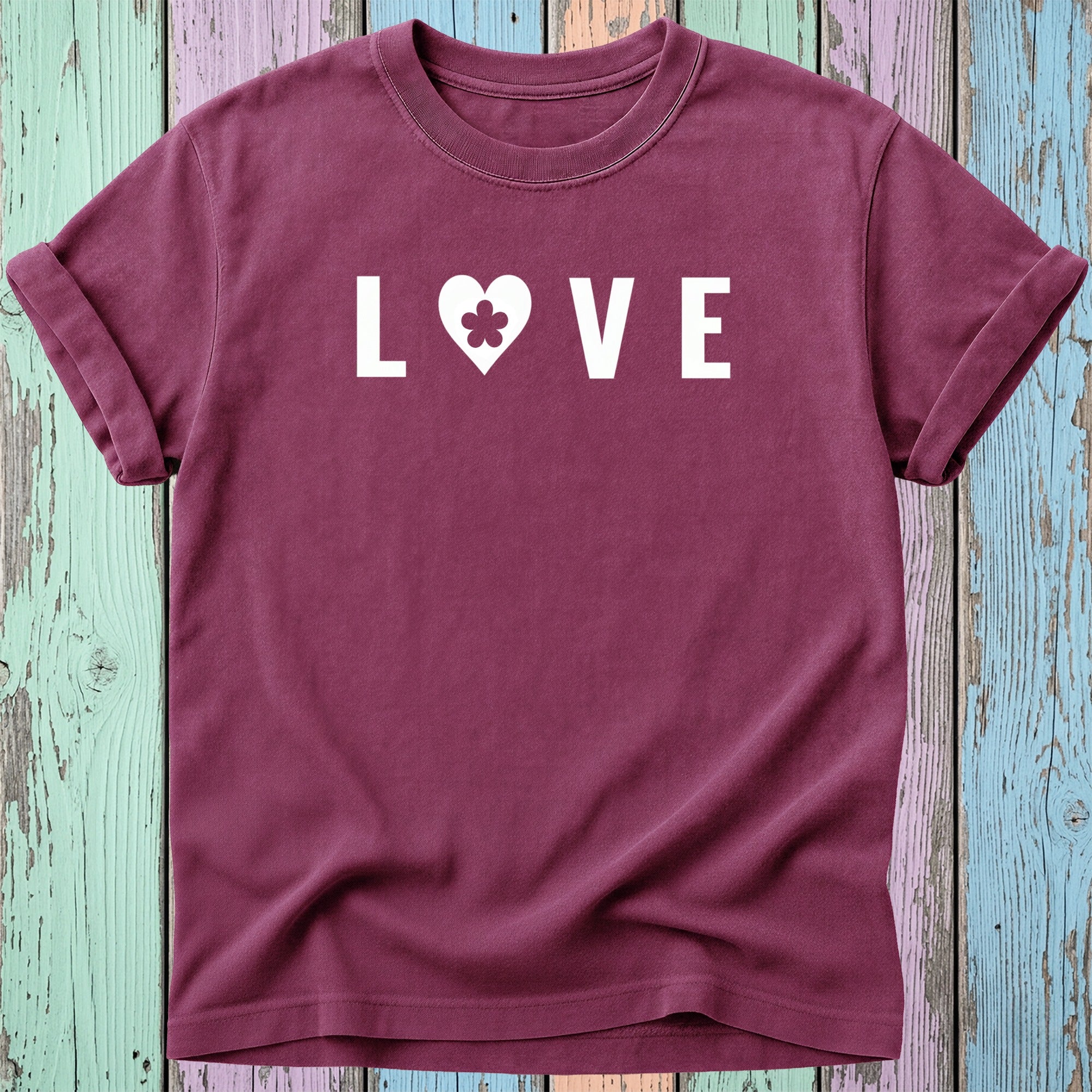 Maroon t-shirt with white "LOVE" graphic featuring a clover heart.