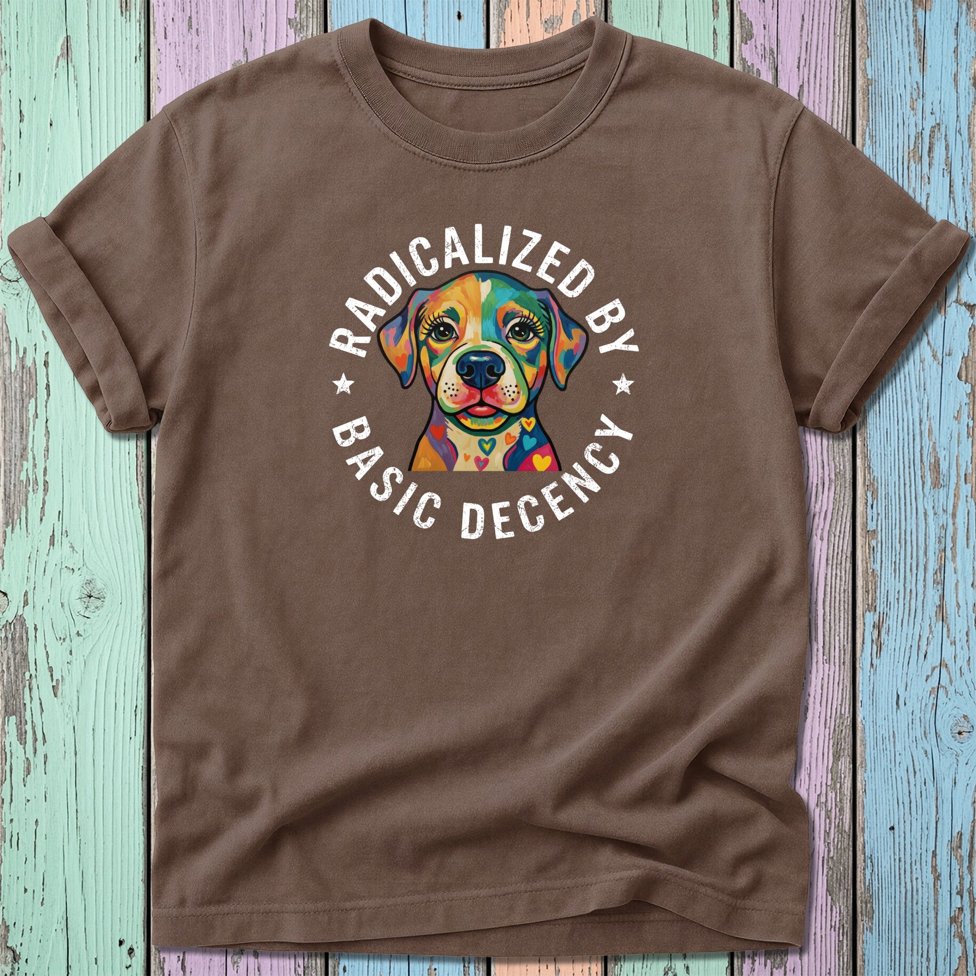 Brown t-shirt with colorful dog graphic and text "RADICALIZED BY BASIC DECENCY".