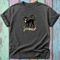 Black cat with green eyes, clovers, and horseshoe art on a dark t-shirt.