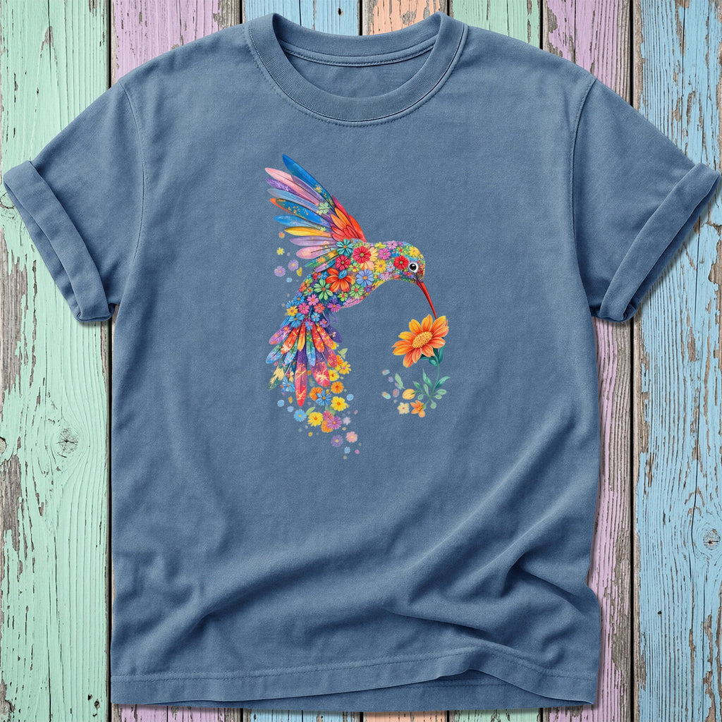 Blue t-shirt with colorful floral hummingbird design and orange flower.