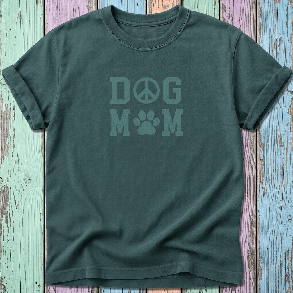 Green t-shirt with "DOG M M" text featuring a peace sign and paw print.