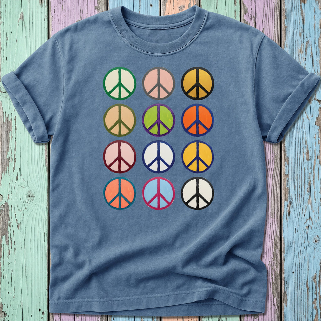 T-shirt with a grid of twelve colorful peace sign designs.