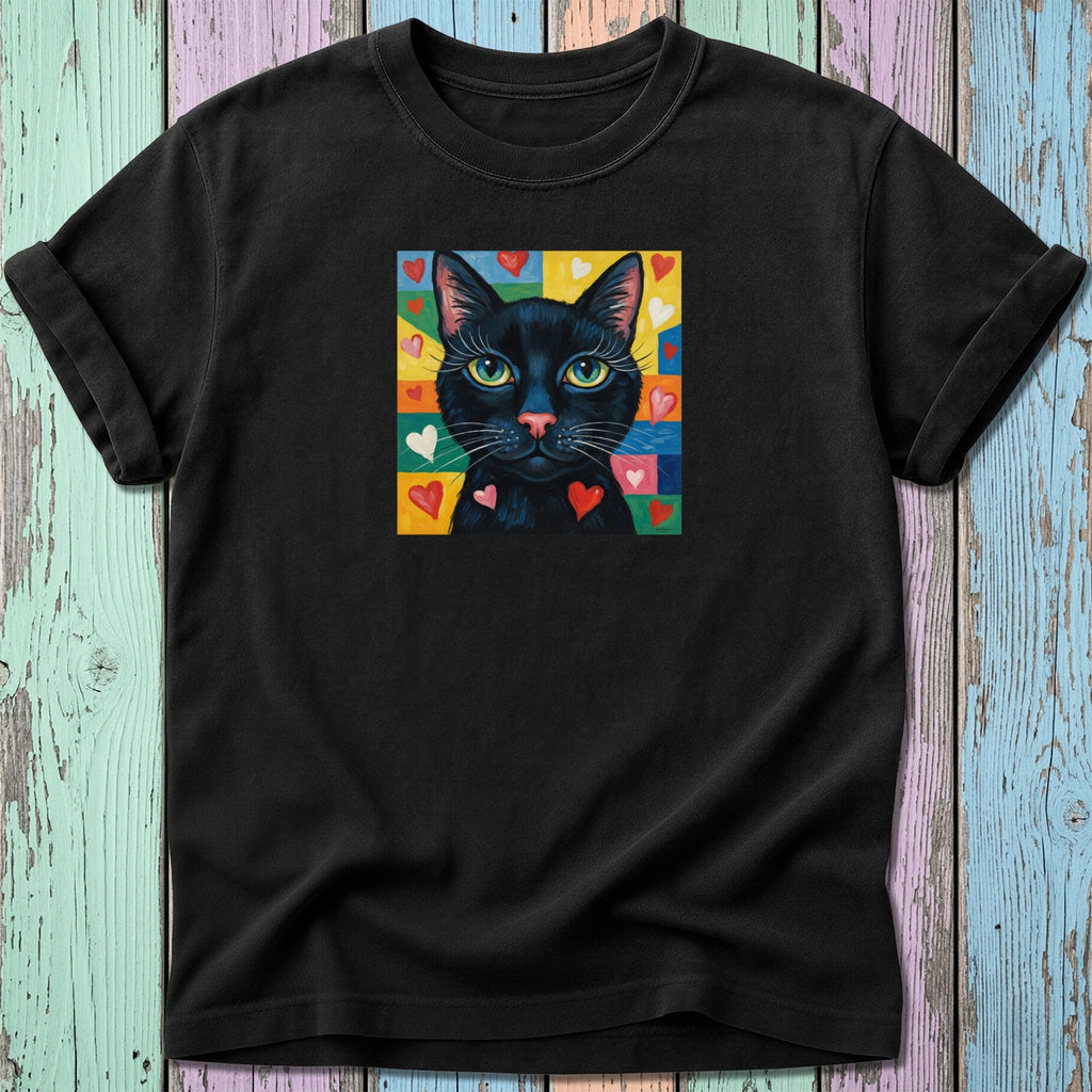 Black cat with colorful hearts on a black t-shirt.