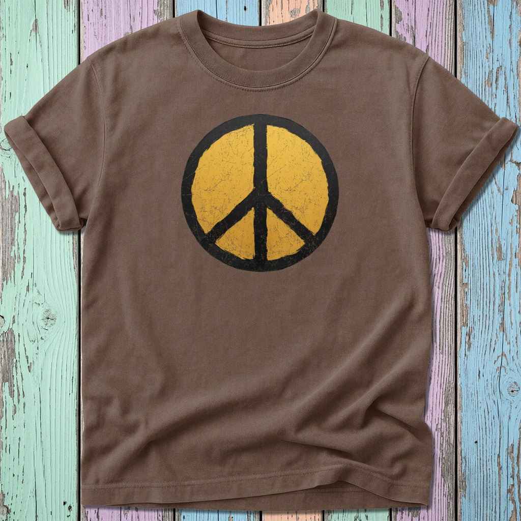 Brown t-shirt with distressed yellow peace sign graphic.