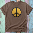 Brown t-shirt with distressed yellow peace sign graphic.