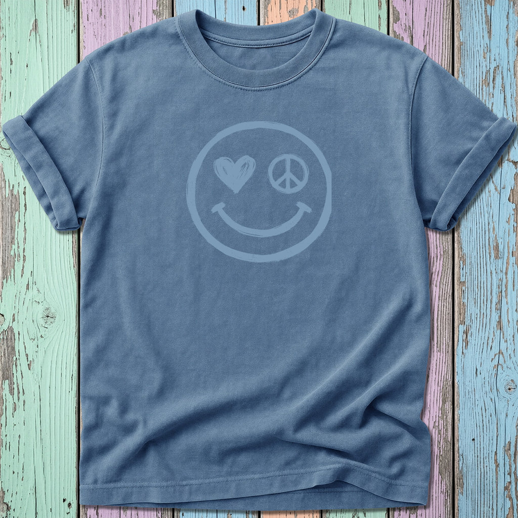 Blue t-shirt with a distressed smiley face, heart, and peace sign graphic.
