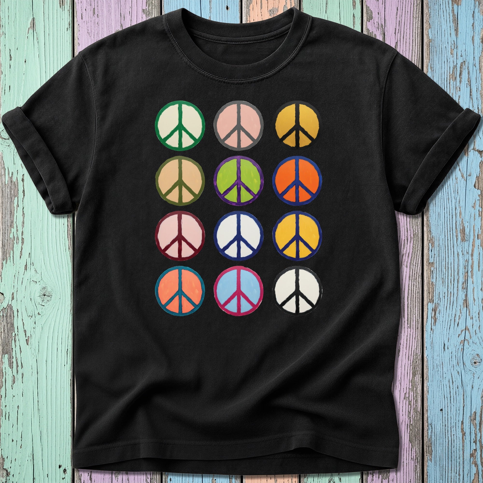 Black t-shirt with a grid of twelve colorful peace sign icons.