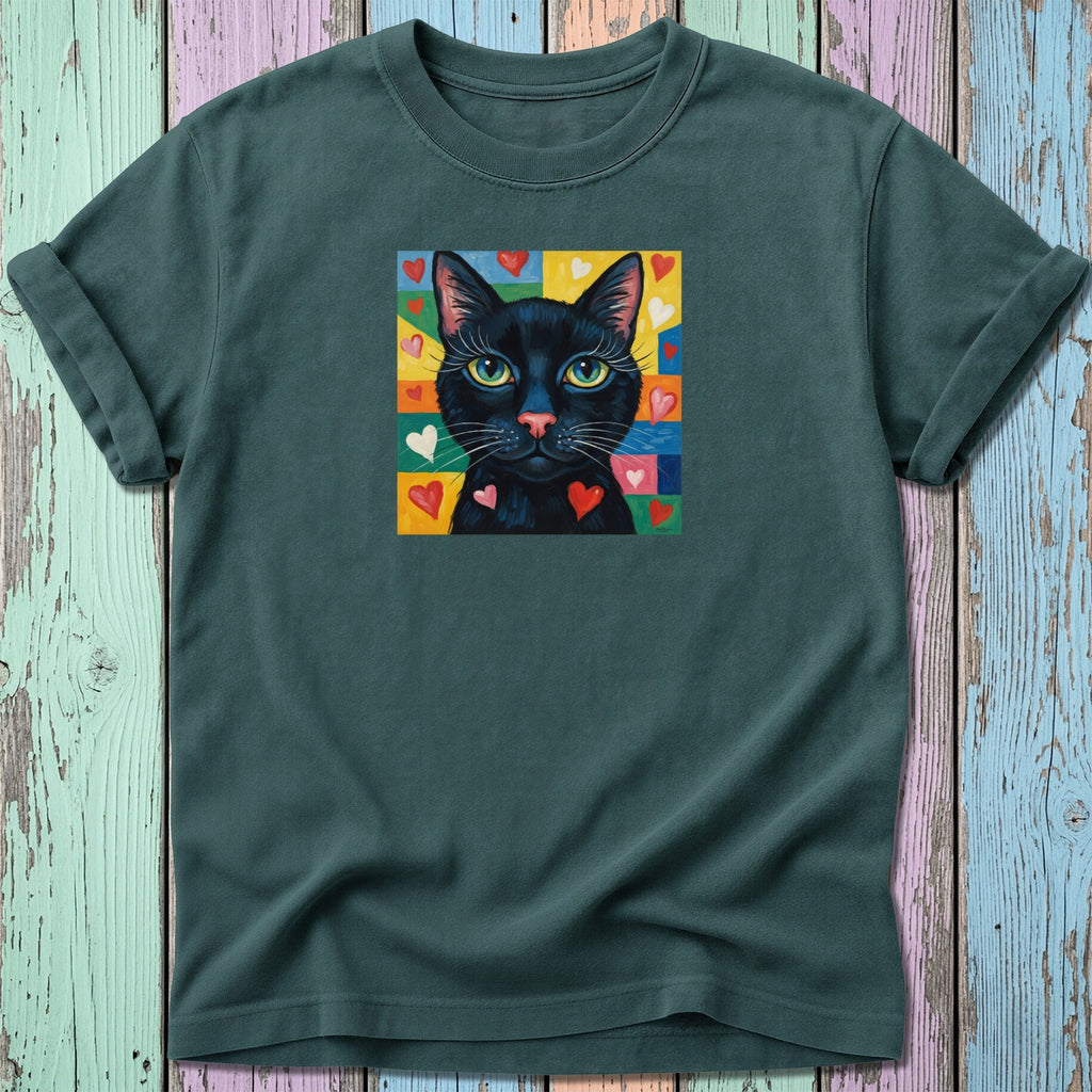 Black cat with pink hearts and colorful background on dark t-shirt.
