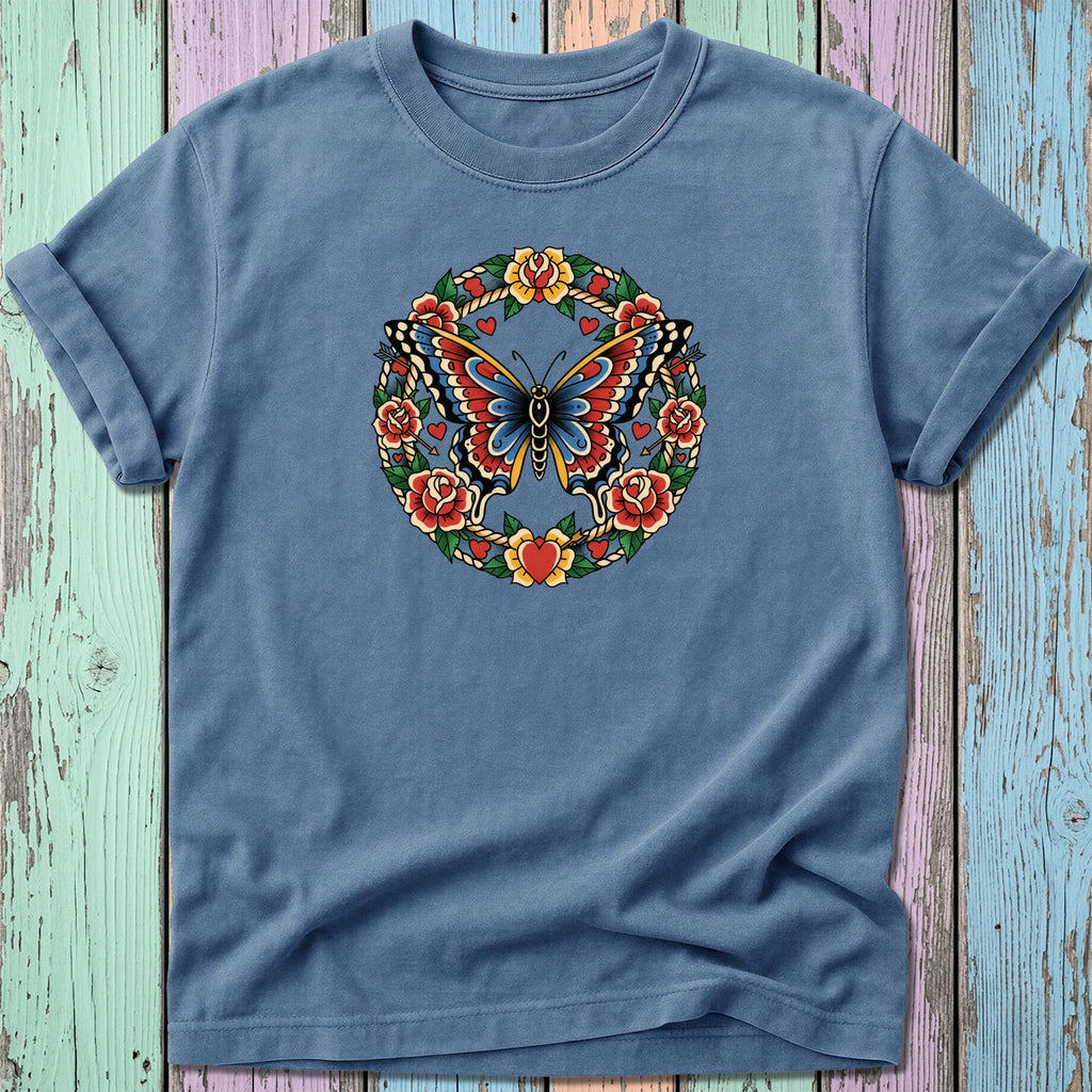 Blue t-shirt with a circular design of a butterfly and roses.