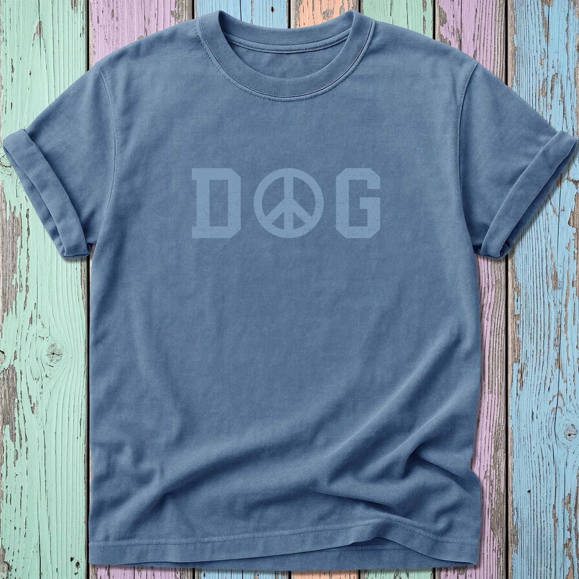 Blue t-shirt with "DOG" and a peace sign graphic.