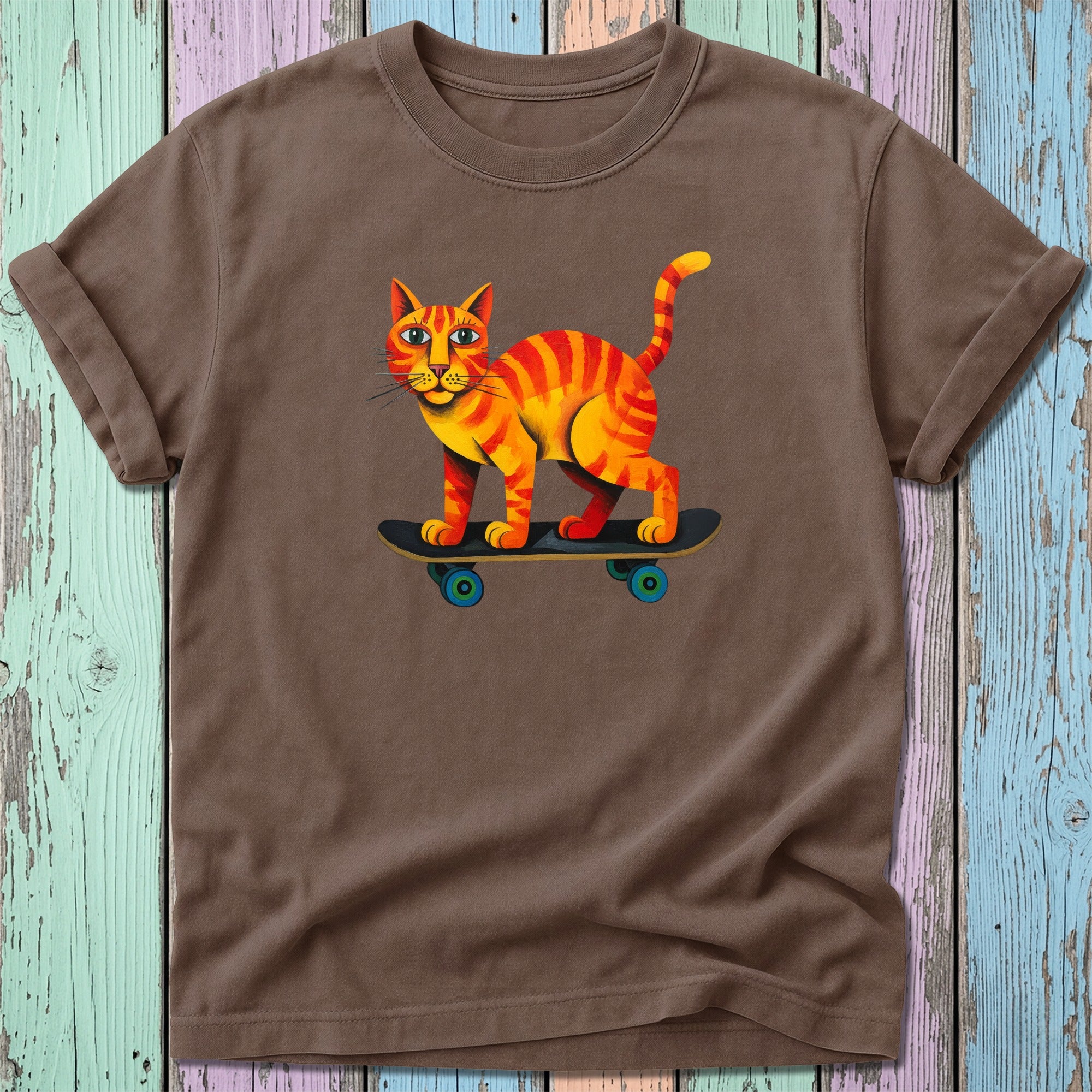 Brown t-shirt with cartoon cat skateboarding graphic.