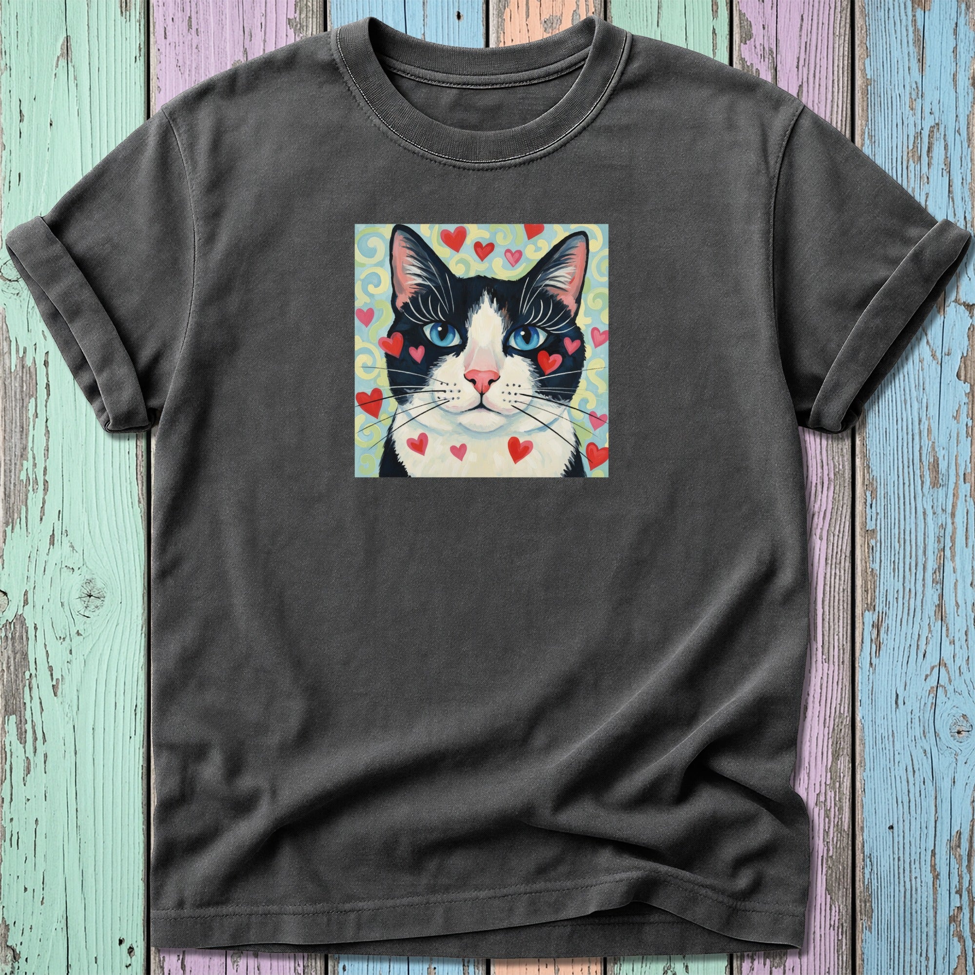 Black and white cat with hearts on a vintage-style t-shirt.