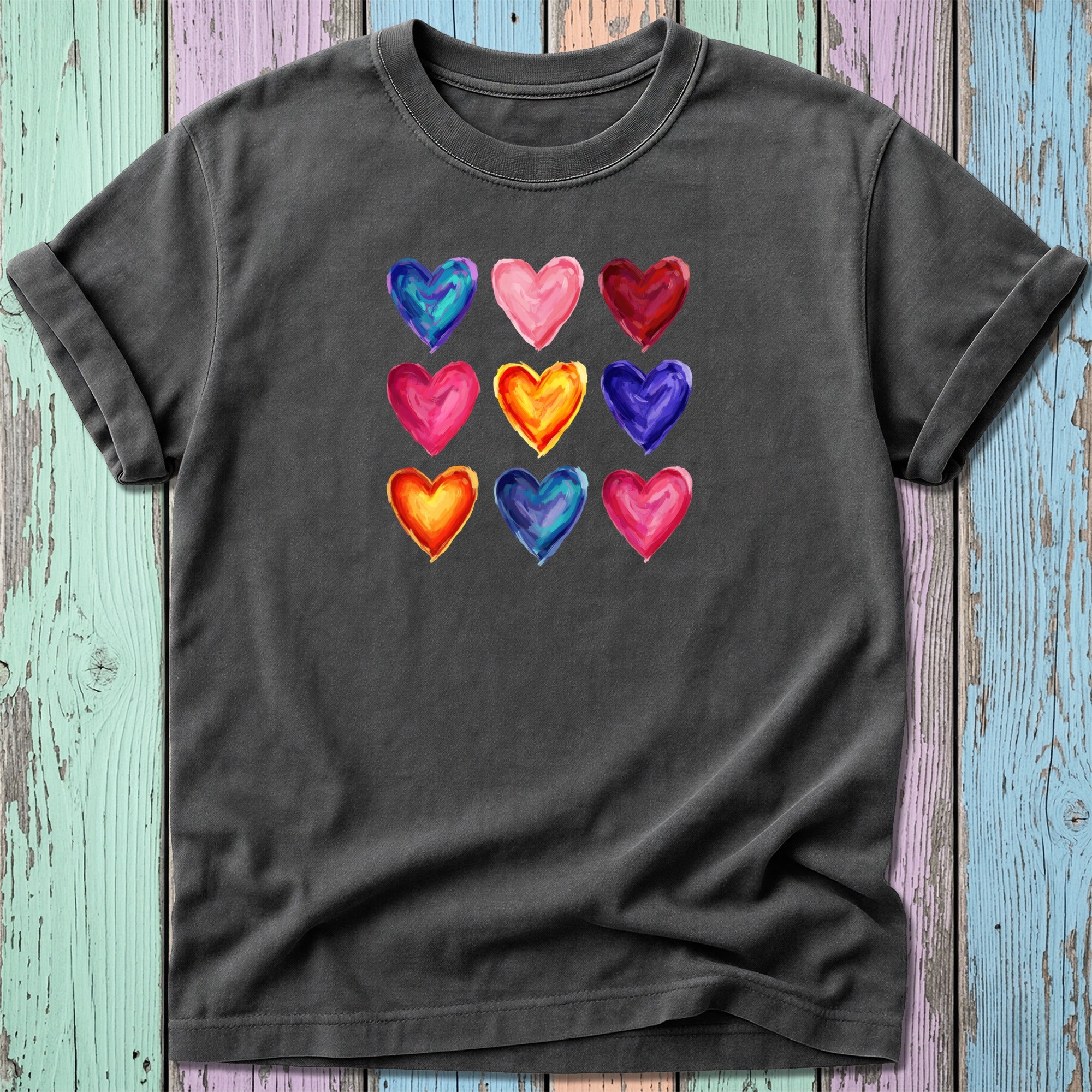 T-shirt with nine colorful watercolor hearts arranged in a 3x3 grid.